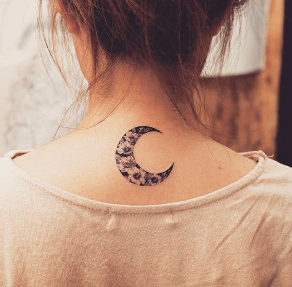 Blackwork floral crescent moon tattoo by Grain