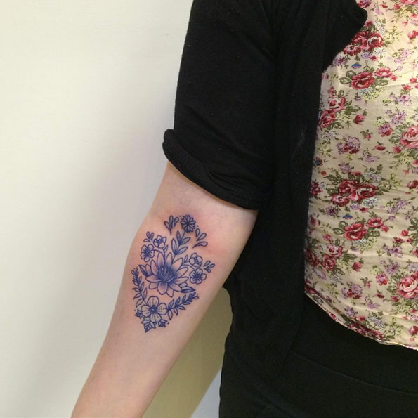 Beautiful blue ink floral piece by Juju