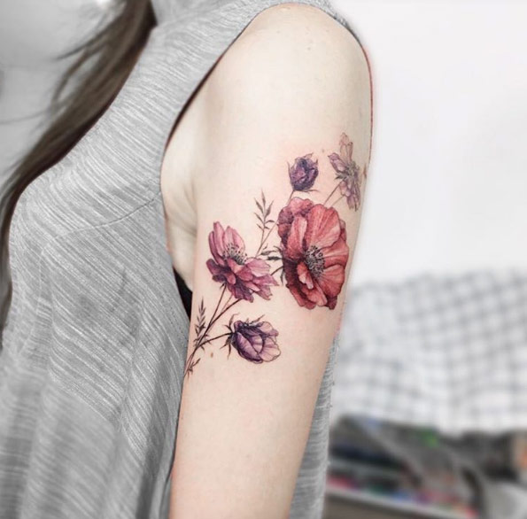 Elegant florals on arm by Tattooist Flower