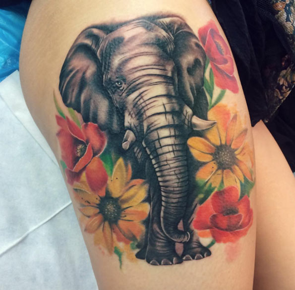 Floral elephant tattoo with an amazing shimmering trunk by Emma Kerr
