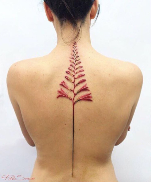 Hyperrealism flower tattoo on back by Pis Saro