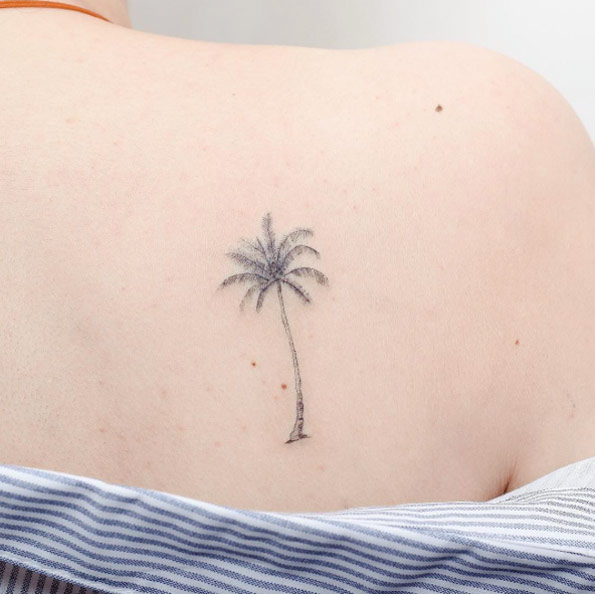 Delicate back shoulder palm by Hello Tattoo