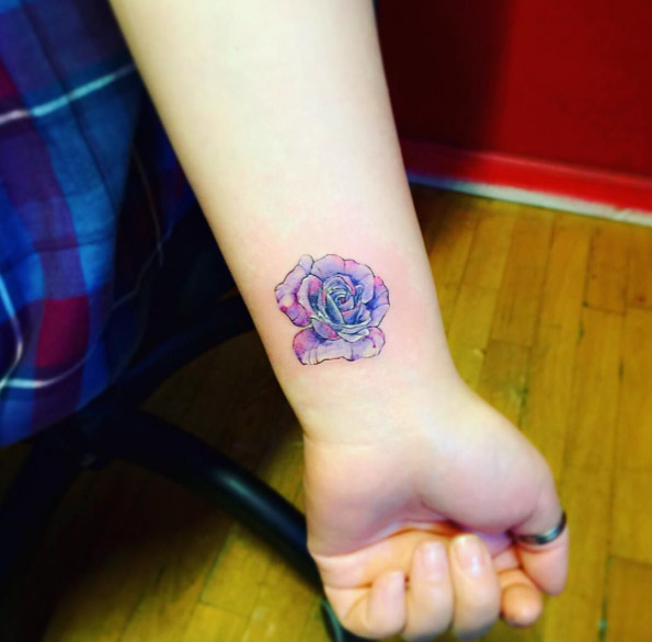 Colorful rose tattoo on wrist by JAY Shin