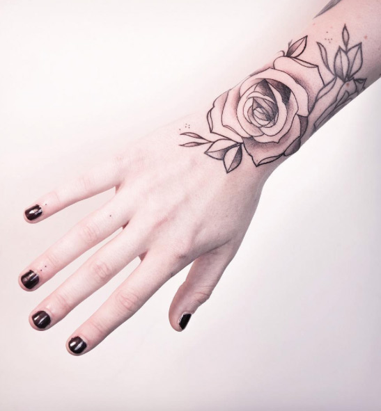 Rose wrist tattoo by Melina Wendlandt