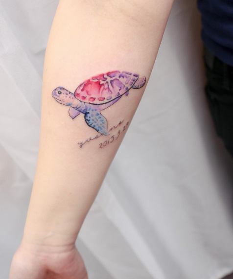Beautiful sea turtle on forearm by Hello Tattoo