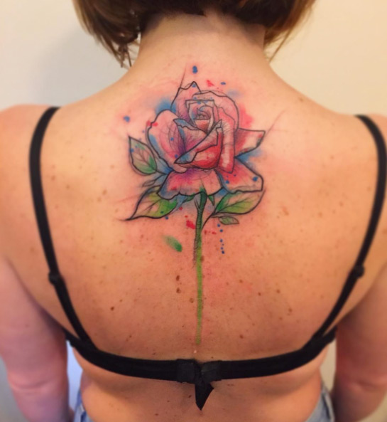 Large watercolor rose tattoo on back by Bora Tattoo