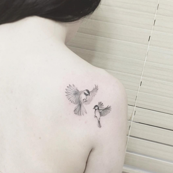 Birds on back shoulder by Tattooist Flower