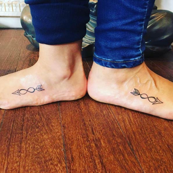 Matching infinity arrow tattoos via Kristy