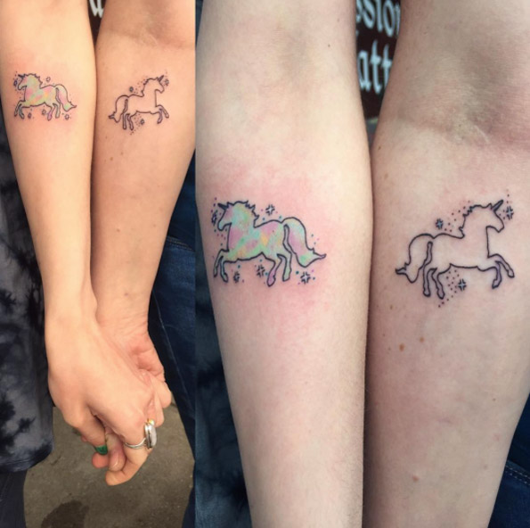 Matching unicorn tattoos in progress by Corin Webb
