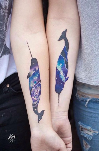 Matching cosmic whale tattoos by Martyna Popiel