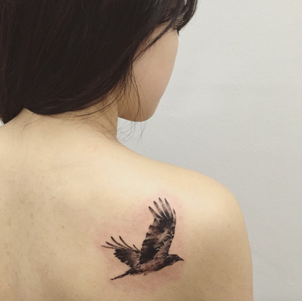 Blackwork crow tattoo on back shoulder by Hongdam