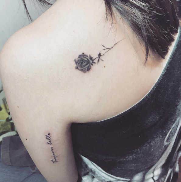 Blackwork rose tattoo on back shoulder by Mojo