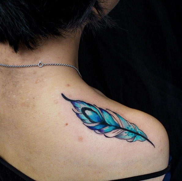 Beautiful blue feather tattoo by Anzo Choi