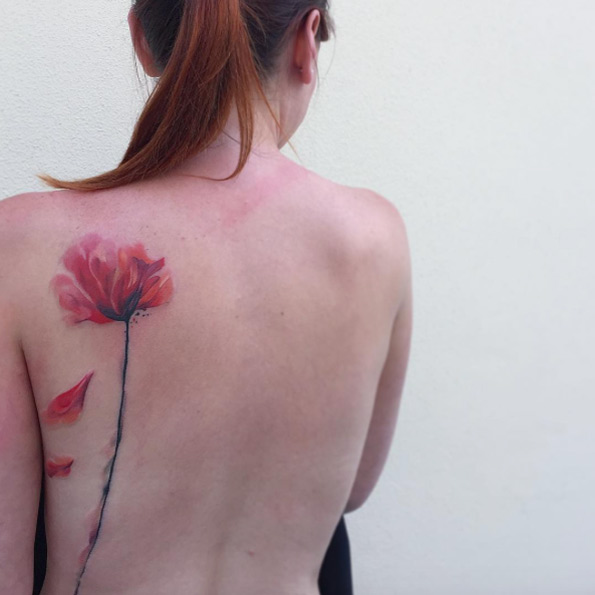 Breathtaking watercolor flower tattoo by Ondrej Konupcik