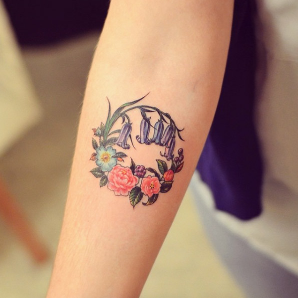 Circular floral tattoo by Grain
