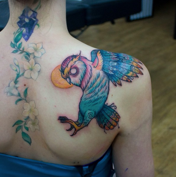 Colorful owl tattoo by Cynthia Sobraty