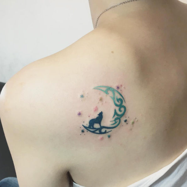 Creative crescent moon on back shoulder by Mojo Tattoo