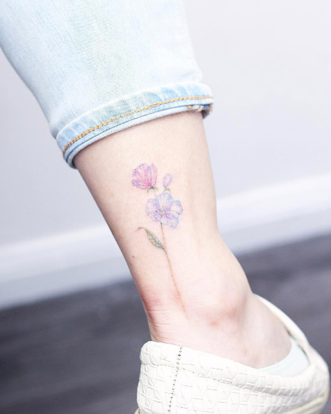 Delicate florals on ankle by Mini Lau