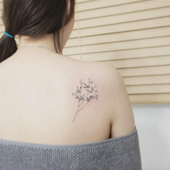 Delicate floral sprig by Tattooist Flower