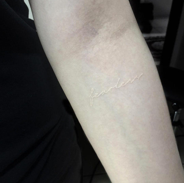 'Fearless' forearm tattoo in white ink by Hadya Natassya