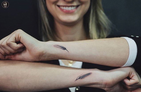 Feather tattoos by Stefani Arruda