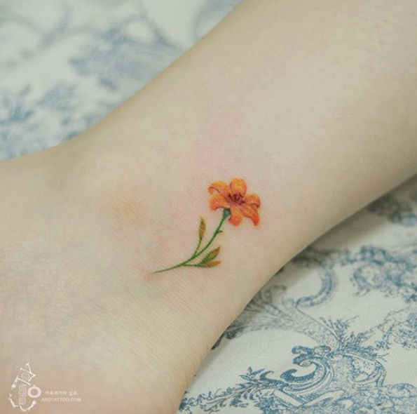 Floral ankle tattoo by Silo