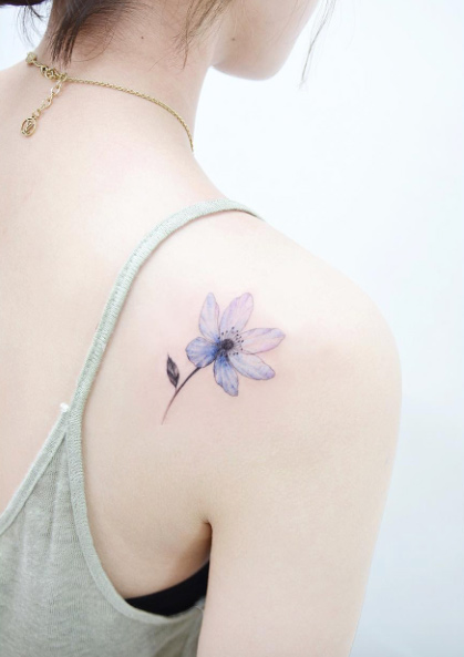 Beautiful bluish back shoulder tattoo by Banul