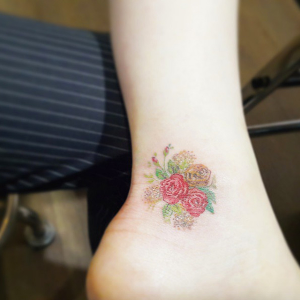 Floral bouquet on ankle by Chaewa