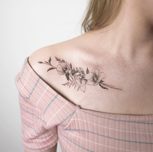 Delicate floral collarbone tattoo by Hongdam