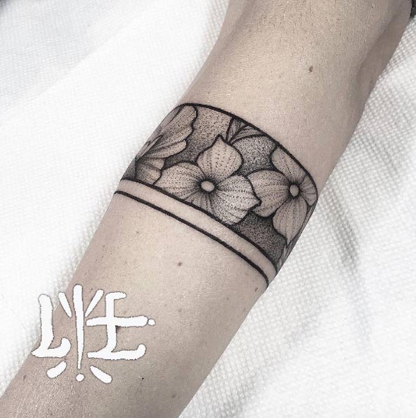 Floral cuff tattoo by Lawrence Edwards