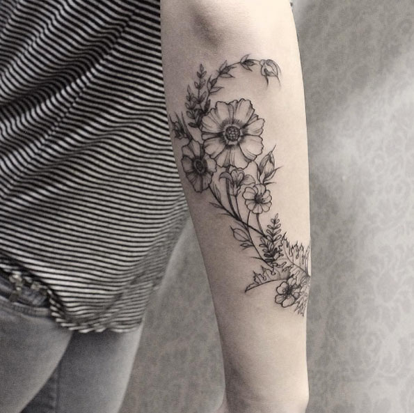 Beautiful floral forearm work by Sandra Cunha