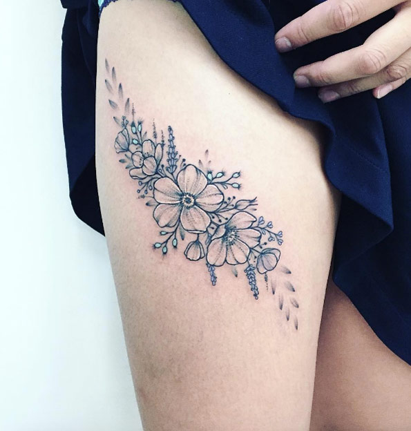 Floral tattoo on thigh by Anna Bravo