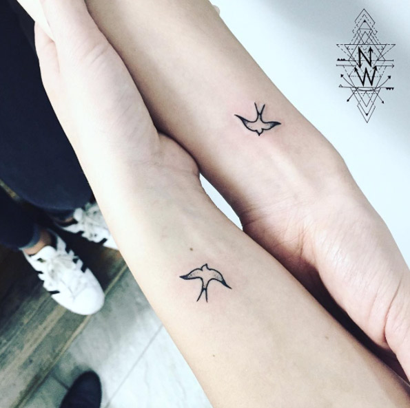 Matching dove tattoos by Laura Martinez