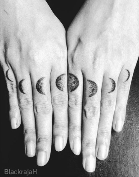 Phases-of-the-moon finger tattoos by Black Rajah