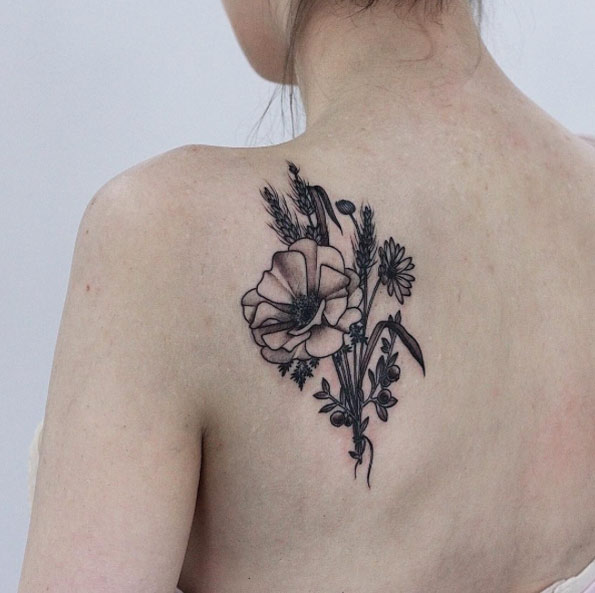 Naturalistic back shoulder tattoo by Olga Nekrasova