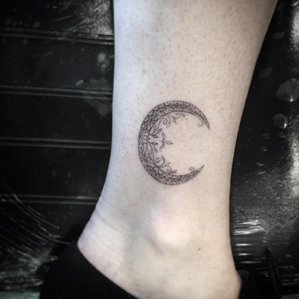 Ornate crescent moon tattoo by Isaiah Negrete