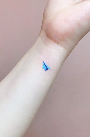 Small blue paper airplane by IDA