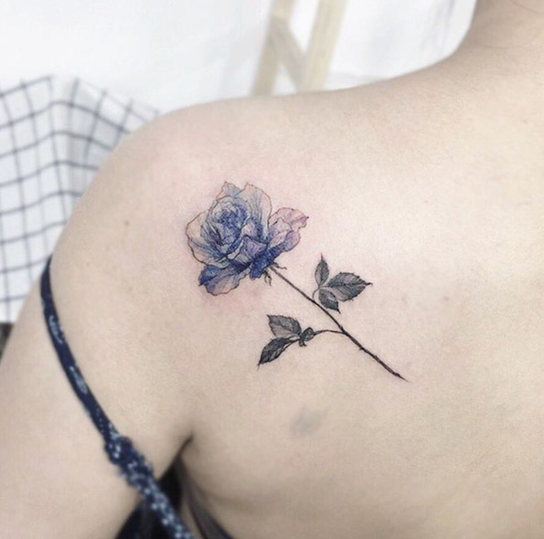 Blue ink rose tattoo on back shoulder by Tattooist Flower