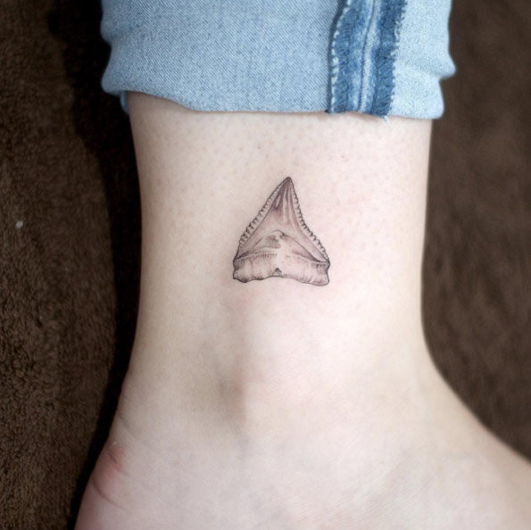 Stunning shark tooth tattoo by Doy
