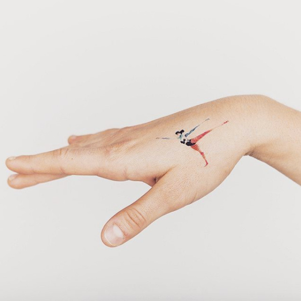 Tiny dancer tattoo on hand.
