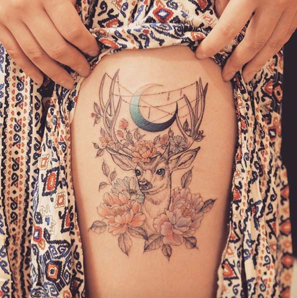 Thigh tattoo with stag, peonies, and a crescent moon by Grain