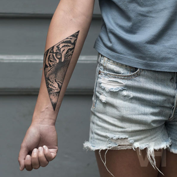 Tiger on forearm by Valentin Hirsch