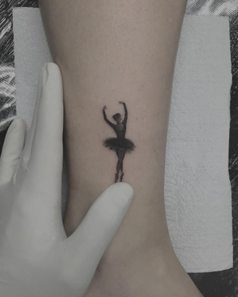 Tiny ballerina tattoo on ankle by Mr. Pacheco