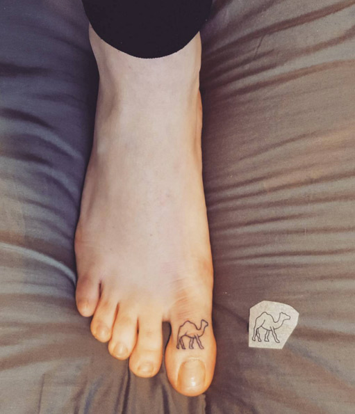 Tiny camel tattoo on toe by Lacey Kay