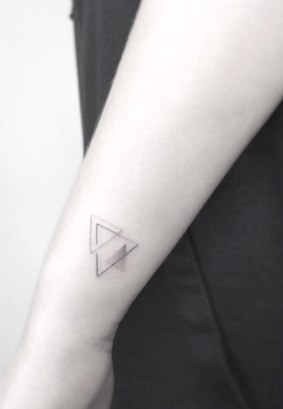 Triangles tattoo by Jakub Nowicz
