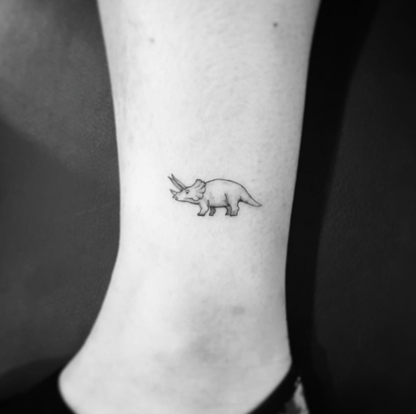 Triceratops tattoo on ankle by OK
