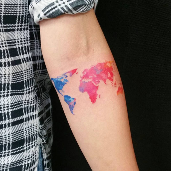 Watercolor world map tattoo by Marta Szumigaj