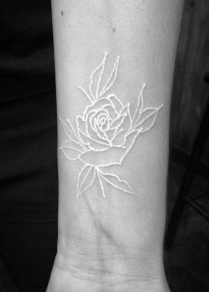 White ink rose on forearm by Tiago Oliveira