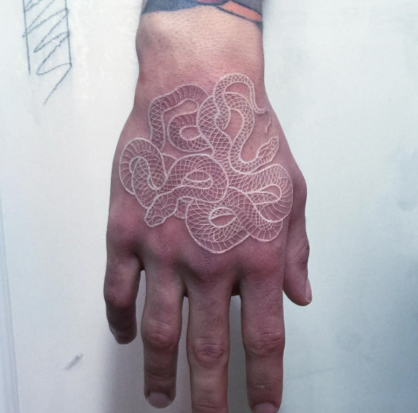 White ink snake tattoo by Mirko Sata