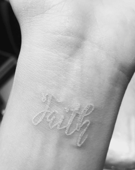 'Faith' white ink tat on wrist via Valeria Jenevette Terrazas 